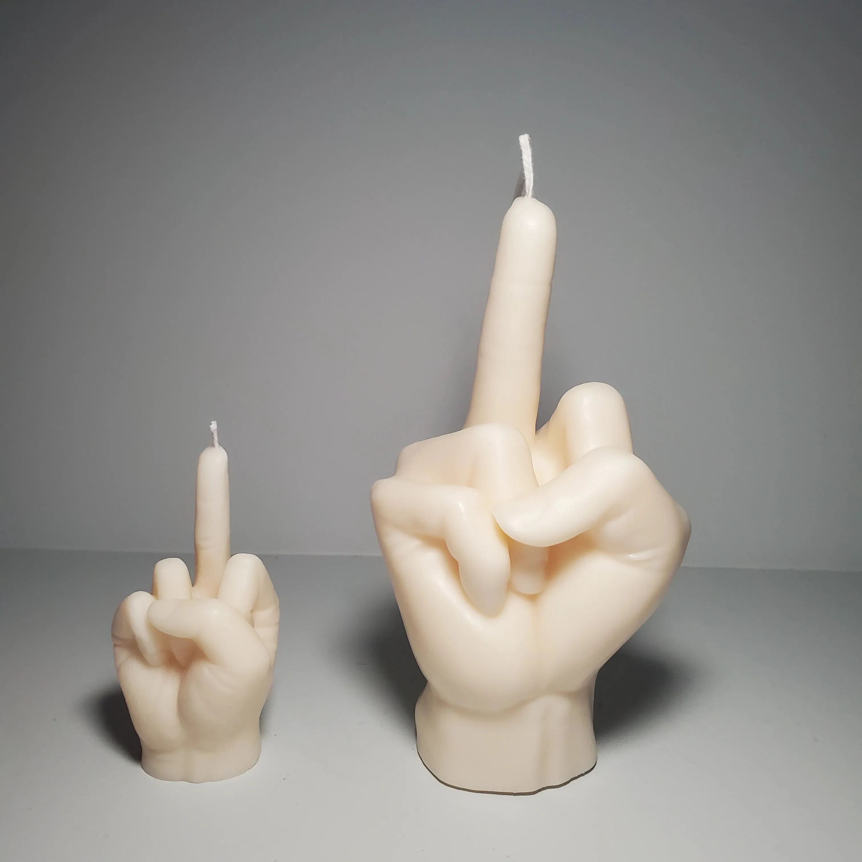 Middle Finger Candle  FLIP OFF sign wax art, protest, defiance, expression, humor, statement, controversy, bold, irreverent, dissent, unconventional art